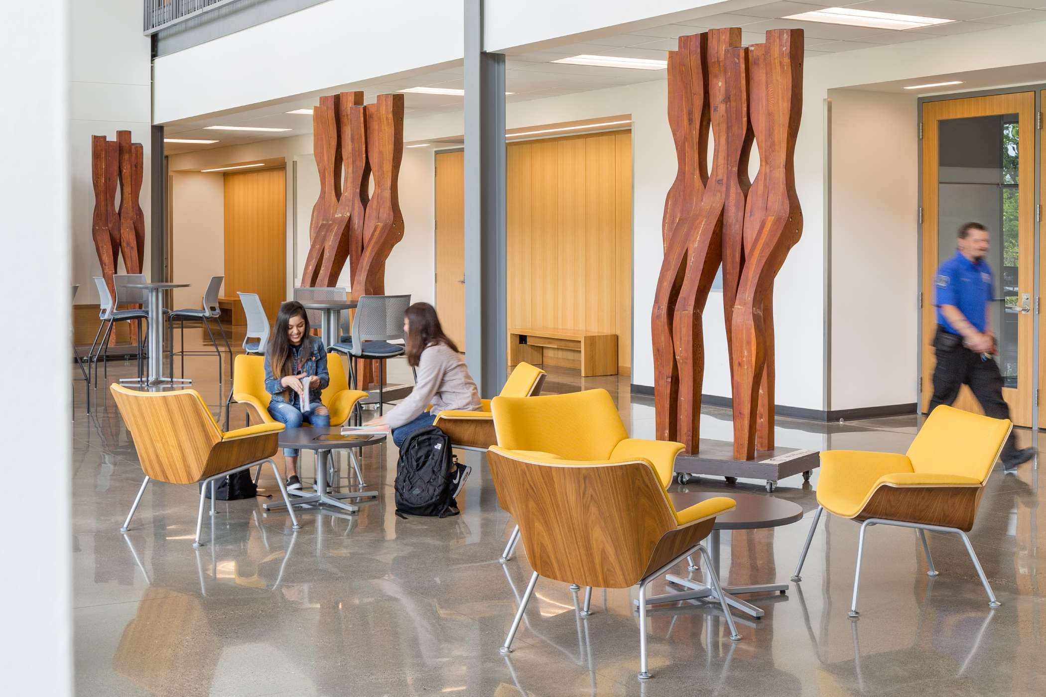 Harmony West's main lounge with students gathered Harmony West's main lounge with students gathered