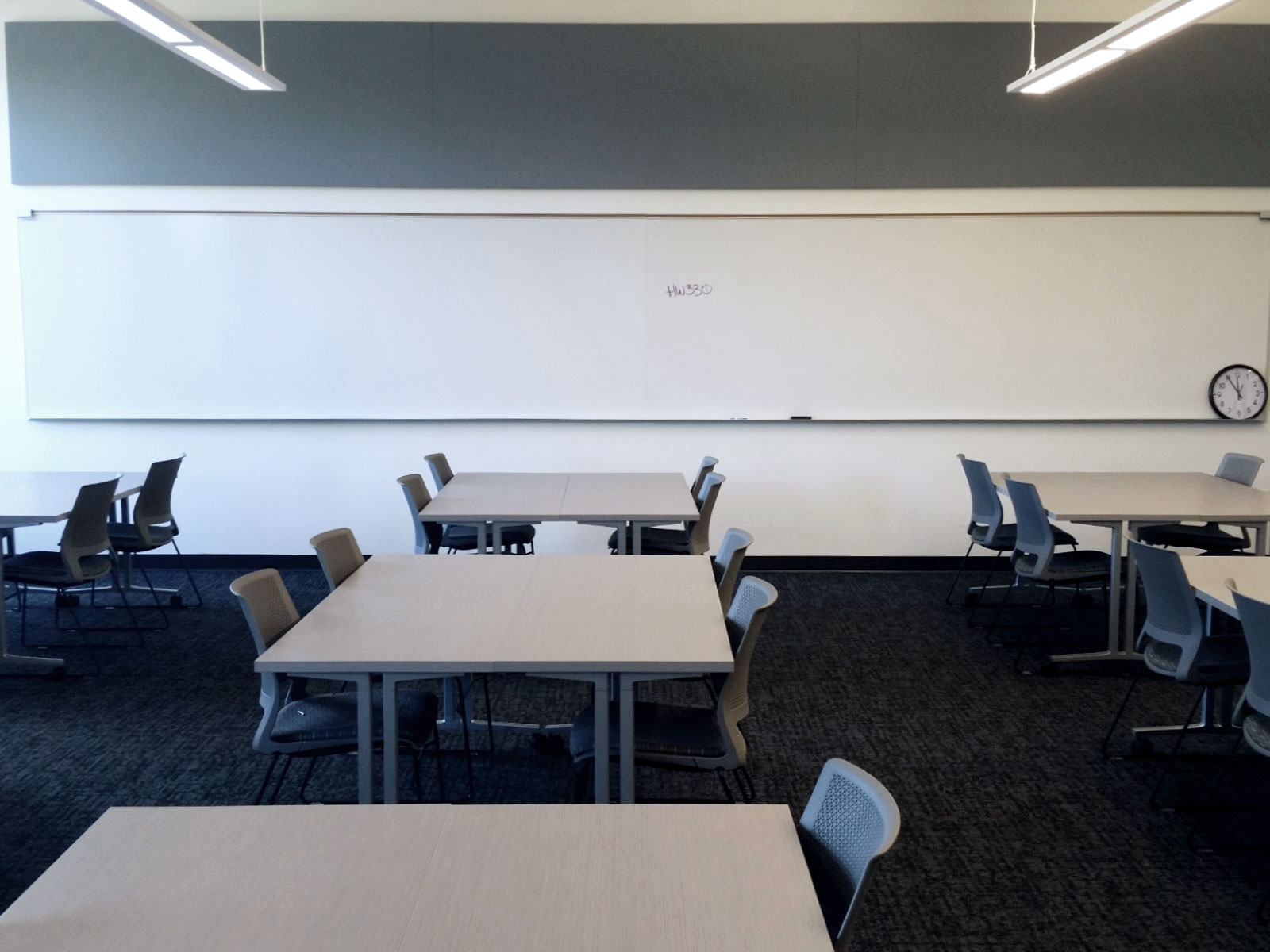 Chairs, tables and whiteboard in Harmony Campus classroom