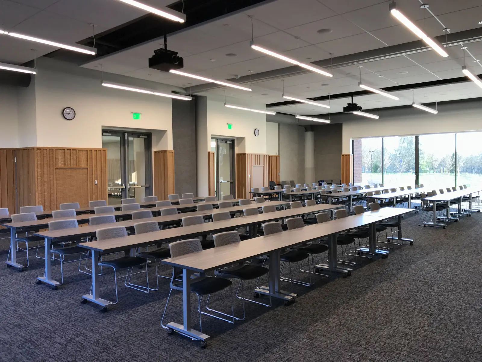 Rows of chairs and tables in a Harmony campus community room