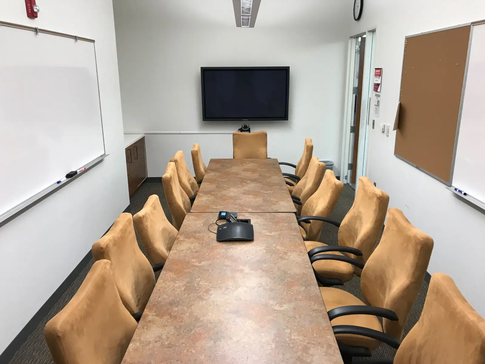 Two rows of chairs and table in a small Harmony campus conference room Two rows of chairs and table in a small Harmony campus conference room