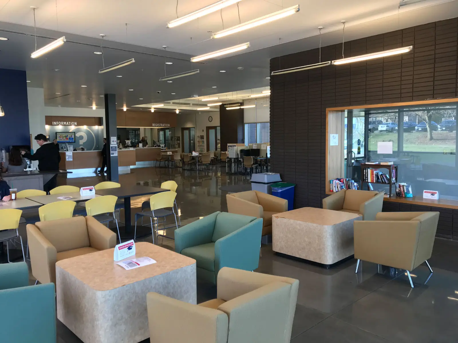 Series of chairs and tables in Harmony Campus lobby Series of chairs and tables in Harmony Campus lobby