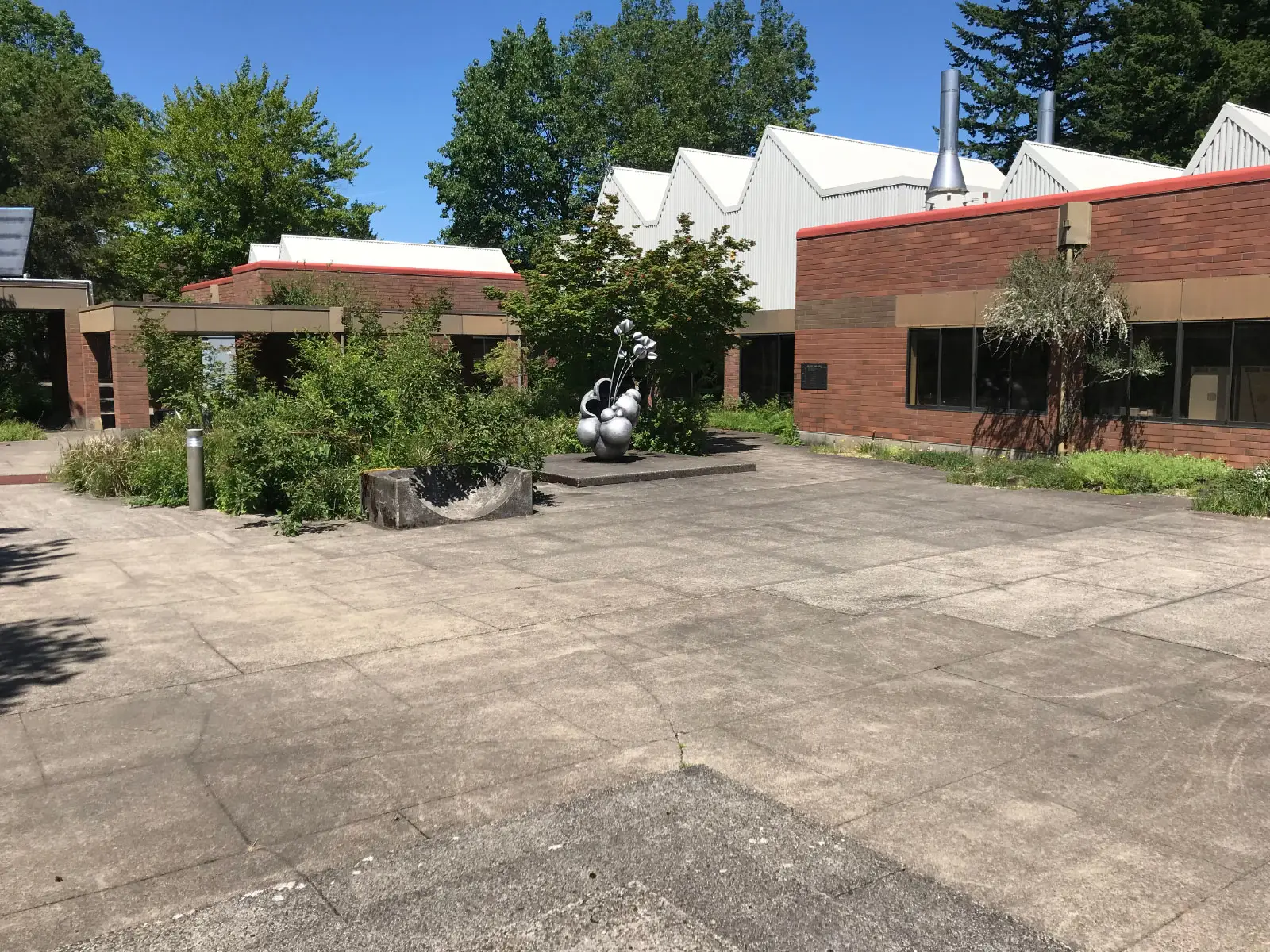 The outdoor statue garden area outside the Pauling Center at the Oregon City campus