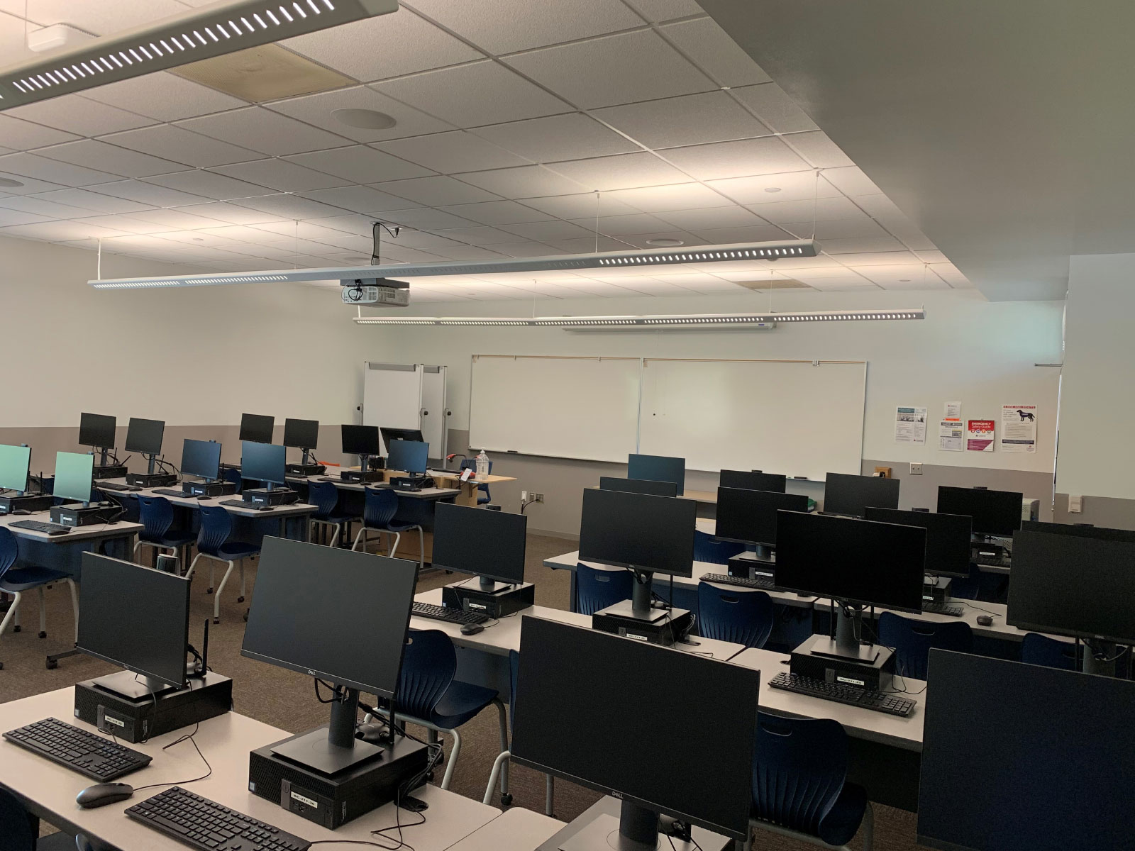 Angled front view of rows of computers on desks in Wilsonville's Computer Lab W211
