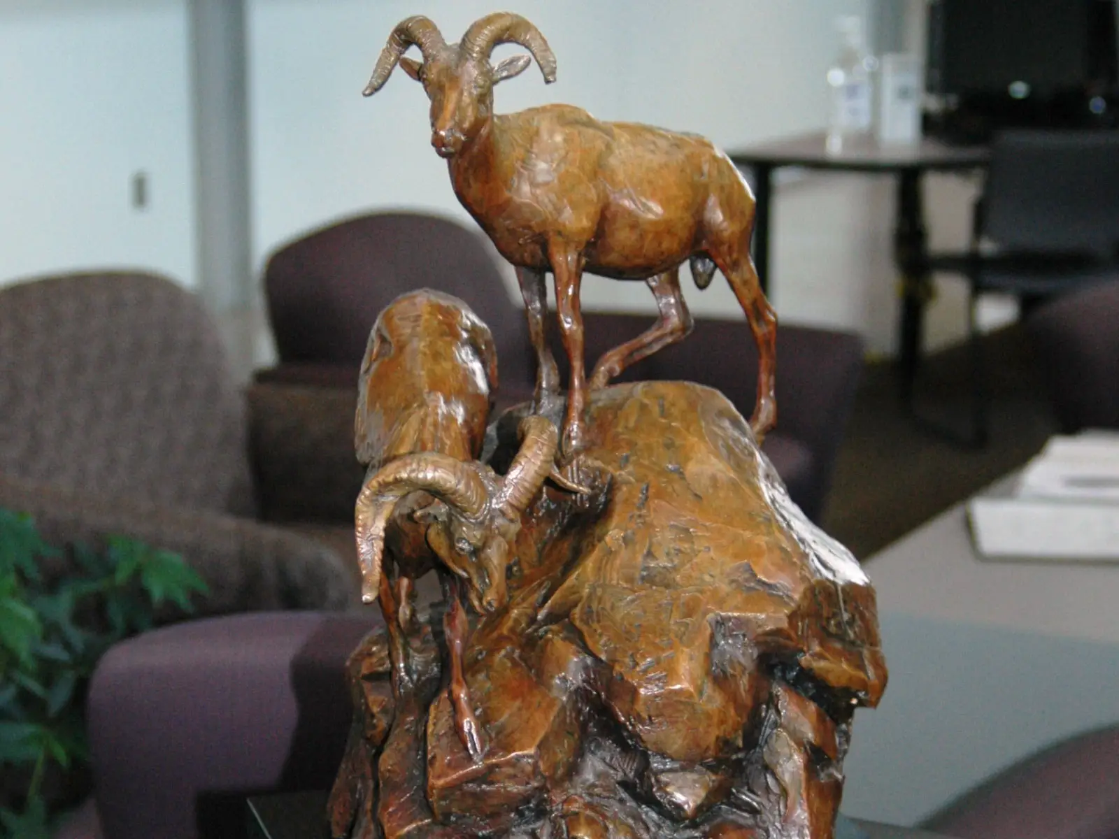 Statue art piece of two goats on a mountain in the Wilsonville campus' commons gallery Statue art piece of two goats on a mountain in the Wilsonville campus' commons gallery