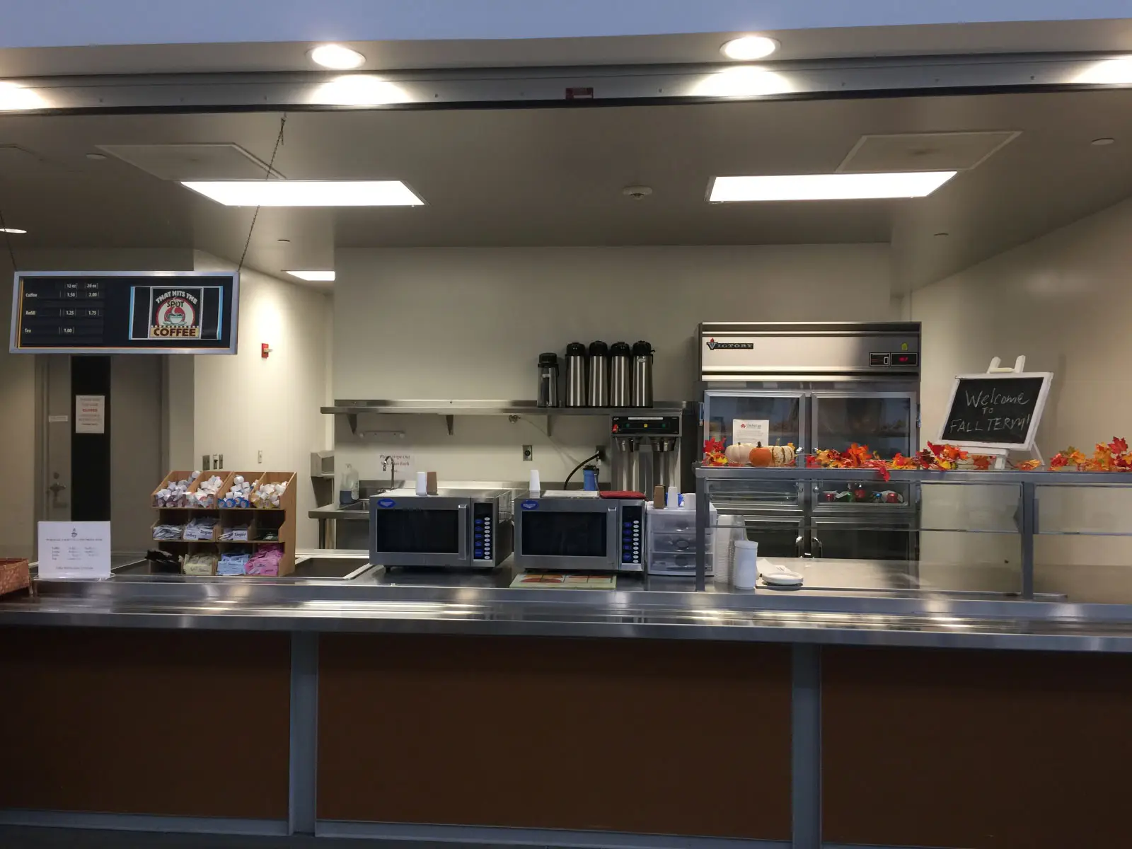 The front of the kitchen area with microwaves, refridgerator, counter and displays of the Wilsonville campus The front of the kitchen area with microwaves, refridgerator, counter and displays of the Wilsonville campus