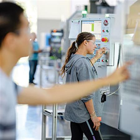 students work on machines in the Industrial Technology Center 