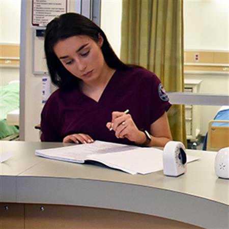 healthcare student fills out paperwork