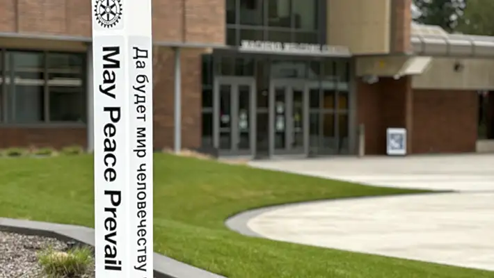 Peace pole in front of Wacheno Welcome Center reads 